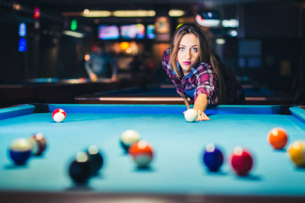 istock Woman and plays billiard and have fun. 1134535003