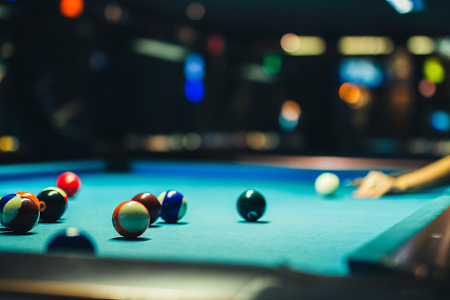 Selective focus shot of a pool table during a game