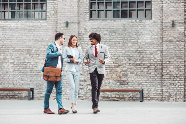 istock Three business people walking outdoors. 1134537612