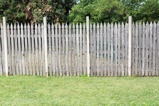 istock Wooden picket fence in the meadow 1134550000