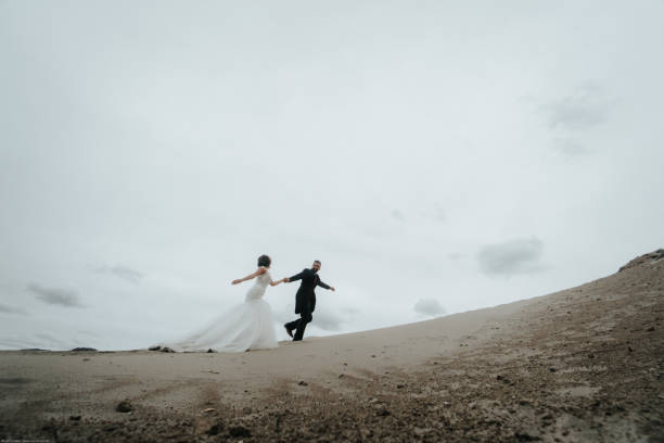 istock The groom drags the bride behind him. 1134561177