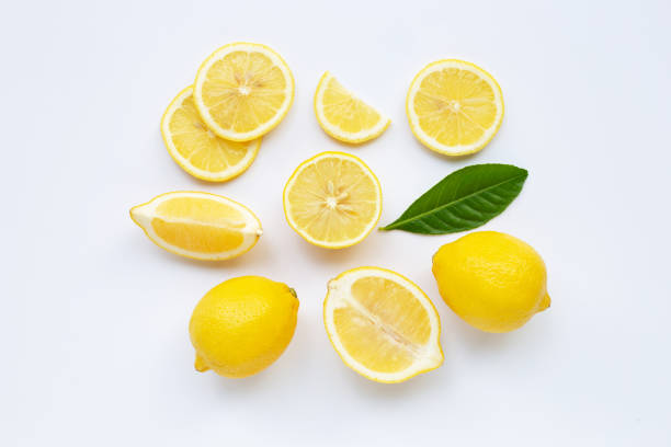 istock Lemon and slices with leaves isolated on white. 1134562190