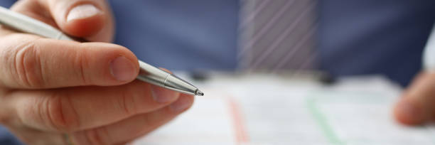 istock Male insurer hand hold silver pen an accident 1134562525