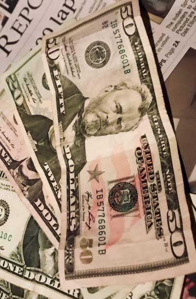 istock Cash and Newspaper 1134567083