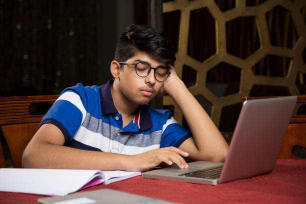 teeanger boy-imagens stock - sleeping high school desk education - fotografias e filmes do acervo