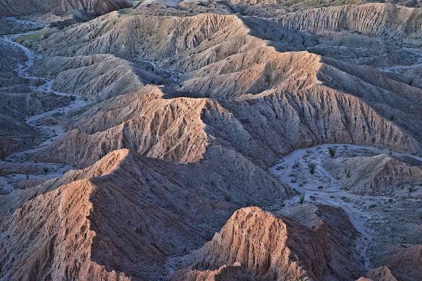 Badlands The Badlands of Anza Borrego at dawn show the inexorable forces forming images of stark beauty. fonts point photos stock pictures, royalty-free photos & images