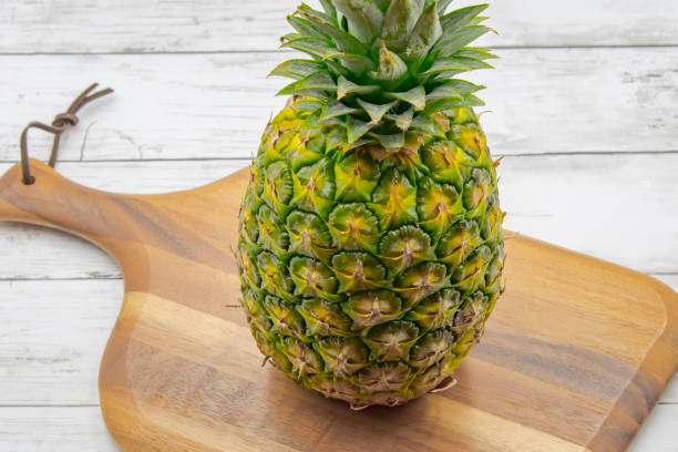 pineapple on the wooden texture background