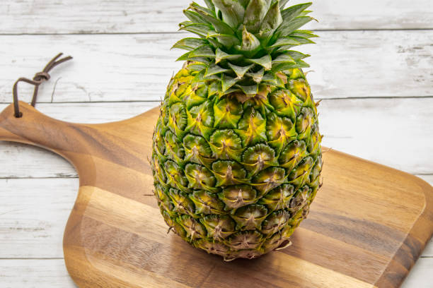 pineapple on the wooden texture background