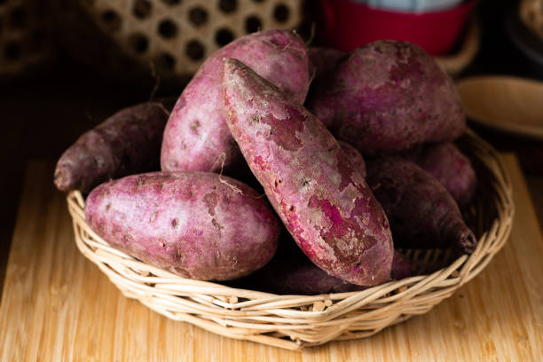 istock Sweet Potatoes Purple Colored on Table 1134578999