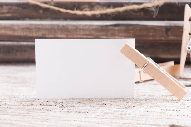 istock Business card blank on wood background 1134579104