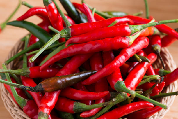 istock Red hot chili peppers in basket 1134579141