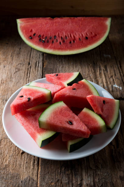 istock Watermelon on wooden table background 1134579206