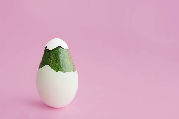 istock Beautiful creative decoration background idea concept for vegan easter with fresh green avocado 1134579350