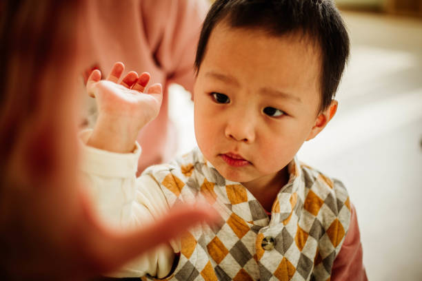 istock Chinese kid and teacher,give me five 1134582776