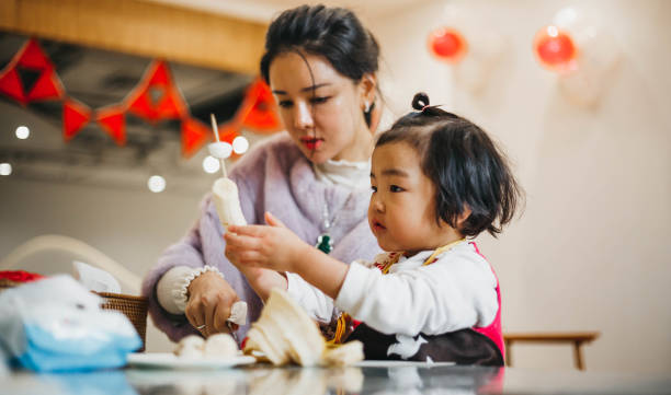 istock Chinese mom helps her daughter 1134582989