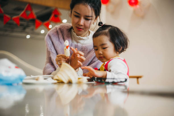 istock Chinese mom helps her daughter 1134583044