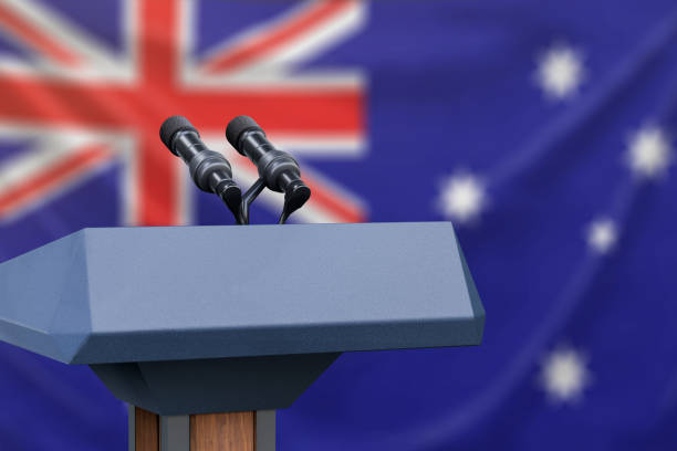 istock Podium lectern with two microphones and Australia flag in background 1134585263