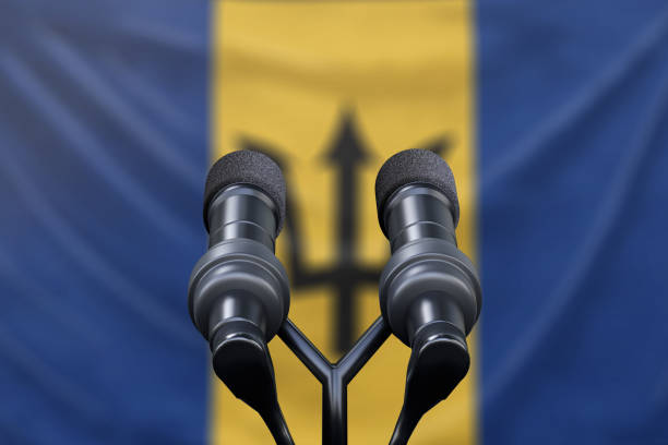 istock Barbados Flag with a podium and microphone 1134585373