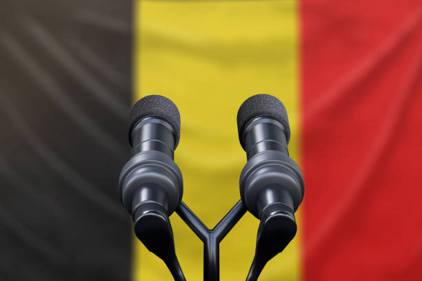 istock Podium lectern with two microphones and Belgium flag in background 1134585928