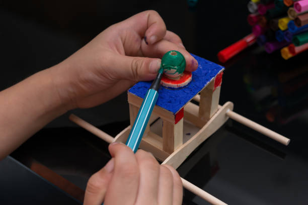 istock kid painting a dummy palanquin 1134587869