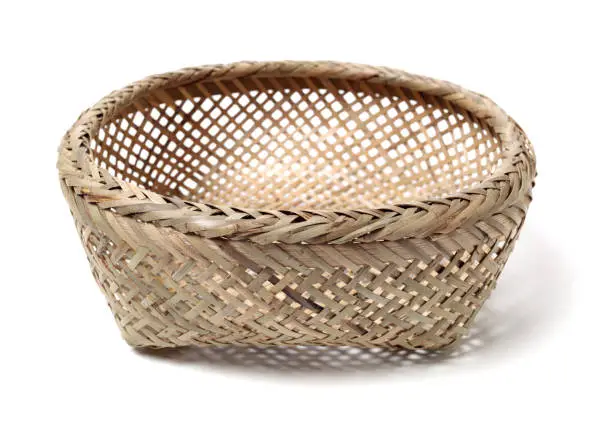 Photo of Bamboo basket hand made isolated on white background. Woven from bamboo tray.