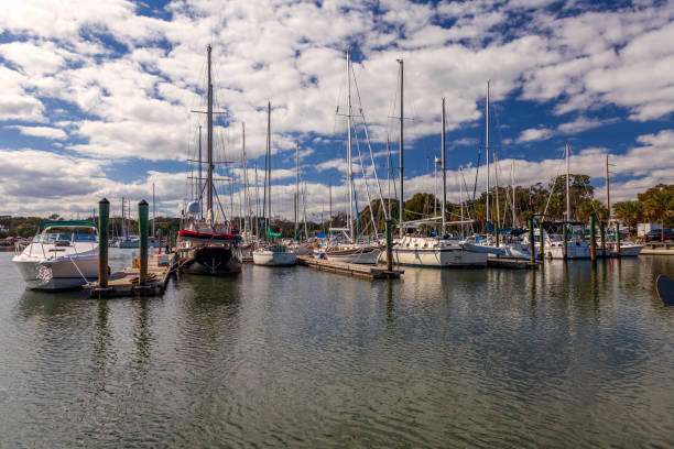 istock St Augustine Florida Marina with Moored Sailboats under beautiful Sky with white puffy Clouds 1134589747