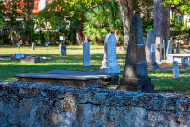 Historic St Augustine  Stone Cemetery Wall with many old grave stones behind it