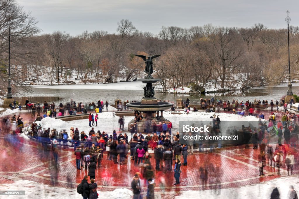 Bethesda Fountain - Central Park New York City - February 11, 2017: Bethesda Fountain on a winter's day surrounded by tourists in Central Park, New York. New Stock Photo