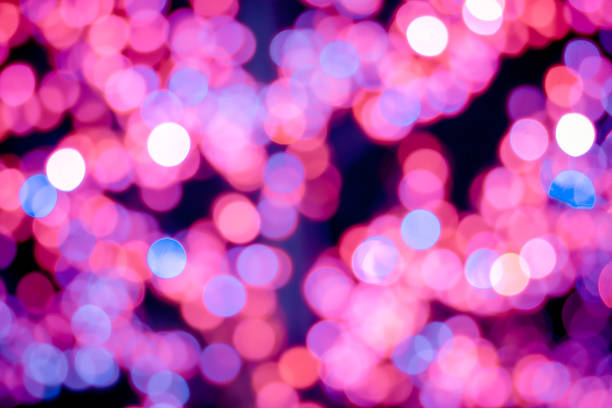 istock Red, pink, white, yellow and turquoise Chrismas lights bokeh 1134590631