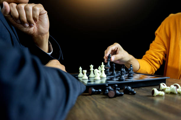 istock Businessman play chess how  to crash overthrow the competitor 1134591944