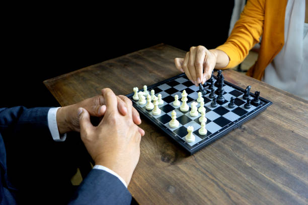 istock Businessman play chess how  to crash overthrow the competitor 1134591950