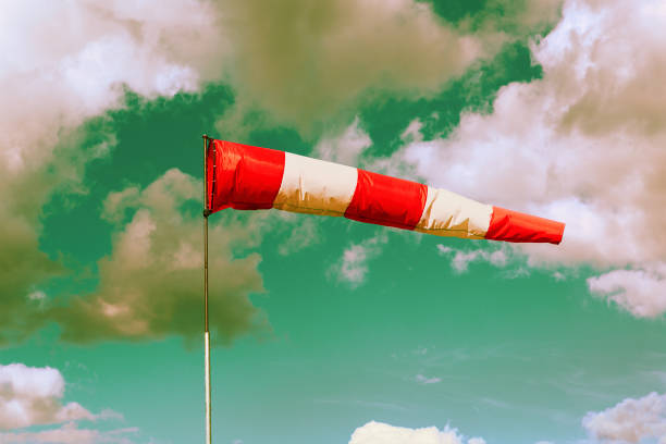 istock Red and white meteorology windsock inflated by wind. Windsock indicate the strength and direction of the wind. 1134592622