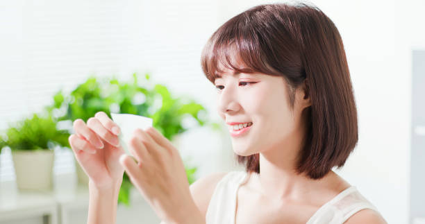 istock woman use oil blotting paper 1134593942