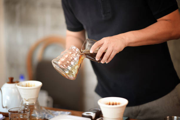 istock Barista making drip coffee and accessories on the table 1134600037