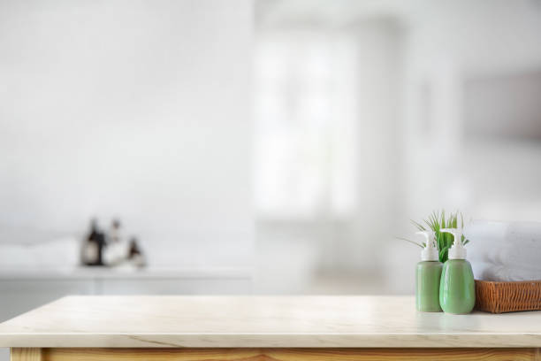 istock Ceramic shampoo bottle with white towels on marble counter in bathroom background 1134600184