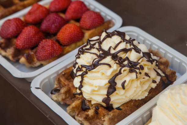 istock Traditional Belgian waffles ready to eat on plates selling at corner bakery 1134600924