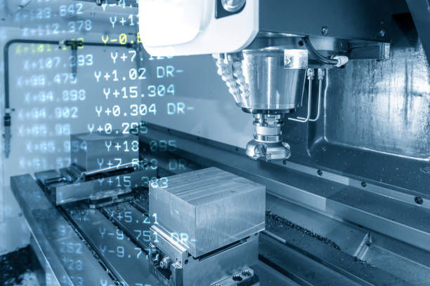 istock The abstract scene of  3-axis machining center and the G-code data rough cutting the mould parts. 1134601055