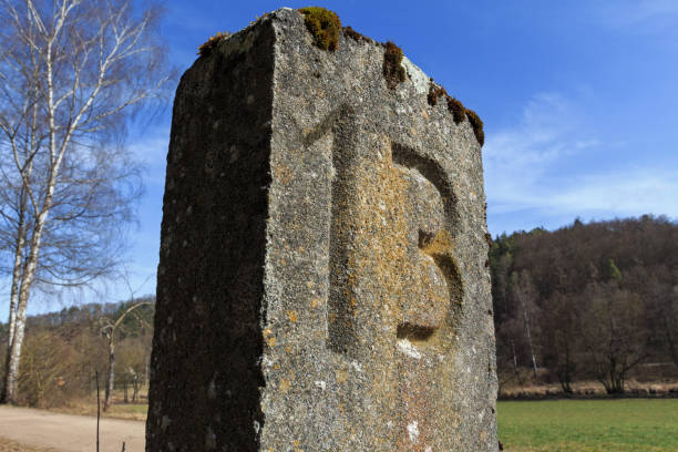 istock Number 13 carved in a kilometer marker along a disused railway track 1134603188