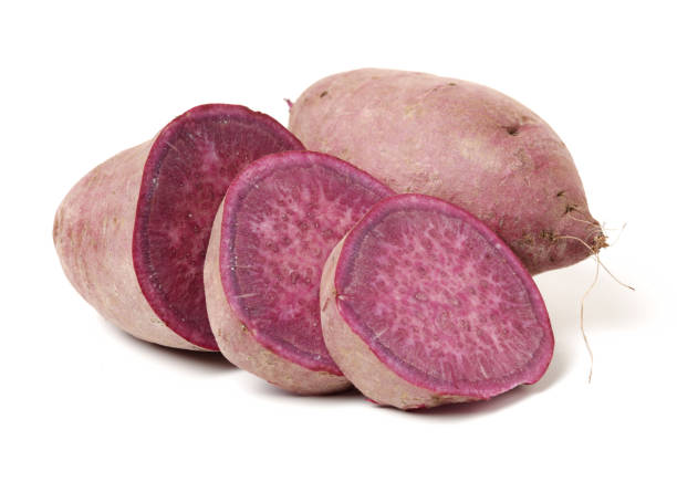 istock Purple Colored Sweet Potatoes on White background 1134604331