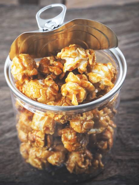 istock Popcorn caramel can on wood background 1134605161