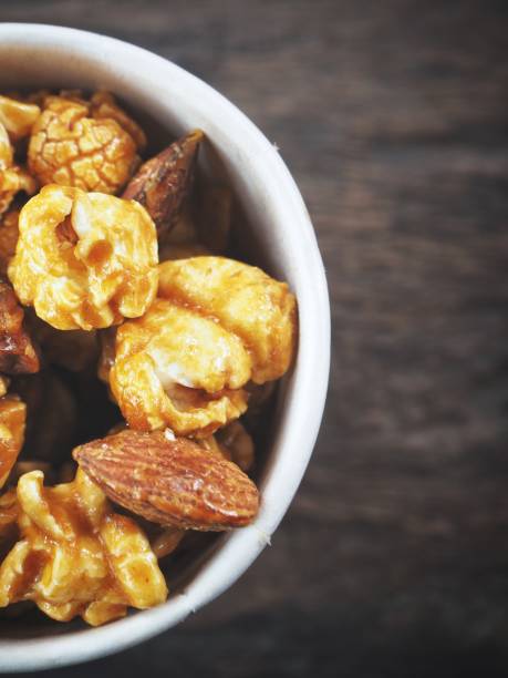 istock Popcorn caramel on wood background 1134605170