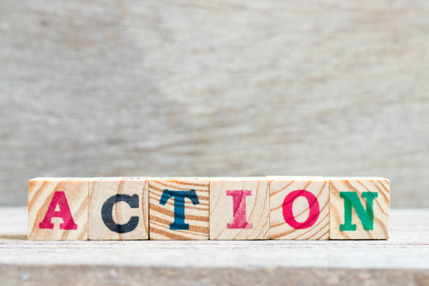 istock Letter block in word action on wood background 1134605373