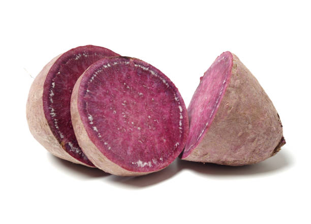 istock Purple Colored Sweet Potatoes on White background 1134605427