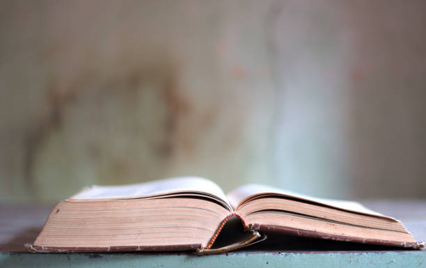 istock an old open book in an old room 1134607196