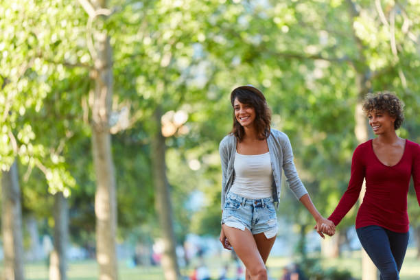 Full length shot of a young couple walking hand in hand in a parkhttp://195.154.178.81/DATA/i_collage/pi/shoots/783185.jpg
