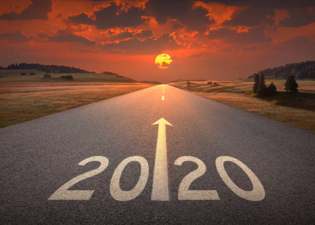 istock 2020 new year at beautiful empty highway at sunset 1134617787