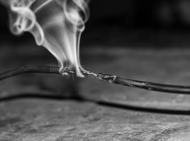 istock burning and smoking an electric cable cause of overload 1134623328