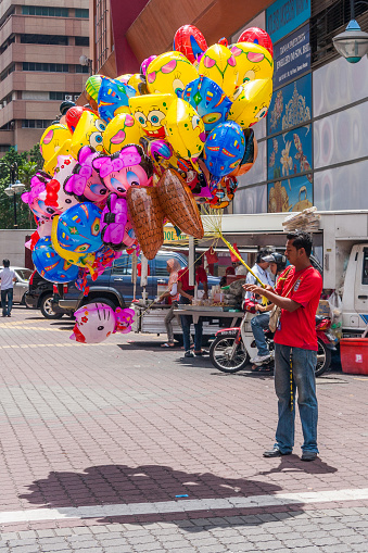 Kuala Lumpur, Malaysia - 6th June 2010: Balloon vendor. . Street vendors are all over the city.