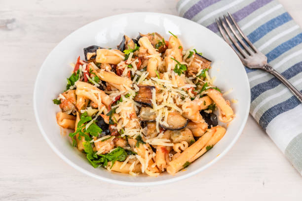 istock Rustic italian vegetarian pasta with fried eggplants and tomatoes. 1134629966