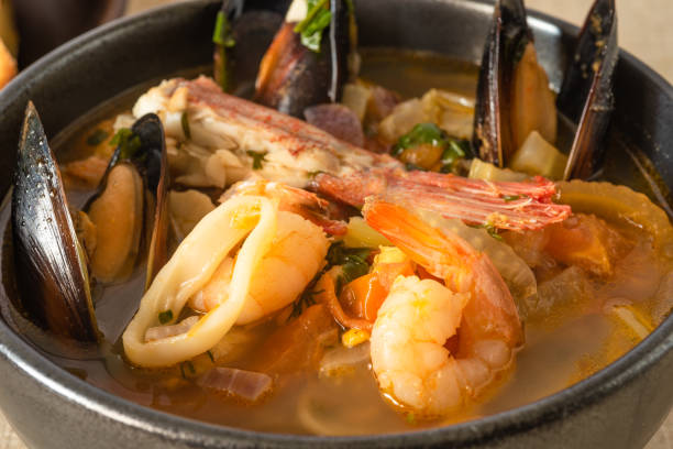 istock Traditional Mediterranean seafood stew in a black bowl closeup. 1134631085